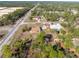 Aerial view of home showing its position with surrounding neighborhood and natural landscape at 11054 Liberto Rd, Weeki Wachee, FL 34614