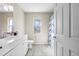 Clean bathroom featuring a white vanity, toilet, and a shower with a patterned curtain at 11054 Liberto Rd, Weeki Wachee, FL 34614