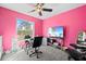 Vibrant pink bedroom with a large window, ceiling fan, and a television on a stand at 11054 Liberto Rd, Weeki Wachee, FL 34614