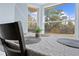 Close up of dining area table, decor, and window backyard view at 11054 Liberto Rd, Weeki Wachee, FL 34614