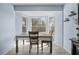 Bright dining area with bay windows offers abundant natural light and backyard views at 11054 Liberto Rd, Weeki Wachee, FL 34614