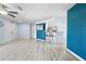 Open concept living space featuring modern floors and a view into the kitchen area at 11054 Liberto Rd, Weeki Wachee, FL 34614