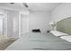 Comfortable main bedroom with neutral colors, ceiling fan, and carpeted floor at 11054 Liberto Rd, Weeki Wachee, FL 34614