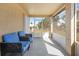 Comfortable screened porch with seating, offering a tranquil outdoor retreat at 11054 Liberto Rd, Weeki Wachee, FL 34614