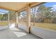 Relaxing screened porch is perfect for enjoying outdoor living and scenic views at 11054 Liberto Rd, Weeki Wachee, FL 34614