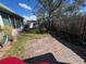 Private backyard with brick patio and wooden fence at 12139 Buffington Ln, Riverview, FL 33579
