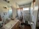 Bathroom featuring tiled shower and vanity with granite countertop at 12139 Buffington Ln, Riverview, FL 33579
