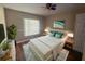 Bright bedroom with a spacious layout, hardwood floors, and large windows providing ample natural light and a relaxing atmosphere at 12139 Buffington Ln, Riverview, FL 33579