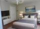 Neutral bedroom offering a comfortable bed, simple decor, and ample space for personalization and relaxation at 12139 Buffington Ln, Riverview, FL 33579