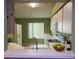 Bright kitchen with white cabinets, modern appliances, and a breakfast bar, perfect for casual dining and entertaining at 12139 Buffington Ln, Riverview, FL 33579