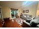 Comfortable living room features modern decor, plush seating, and a sliding glass door at 12139 Buffington Ln, Riverview, FL 33579