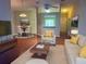 Cozy living room with modern furniture, hardwood floors, and neutral tones creating a welcoming and stylish atmosphere at 12139 Buffington Ln, Riverview, FL 33579