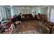 Enclosed sun room filled with furniture and decorations at 12139 Buffington Ln, Riverview, FL 33579