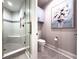 Elegant bathroom featuring a glass-enclosed shower with a built-in bench at 130 Riviera Dunes Way # 606, Palmetto, FL 34221