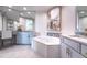 Elegant bathroom with a soaking tub, double vanity, and stylish fixtures for a spa-like experience at 130 Riviera Dunes Way # 606, Palmetto, FL 34221