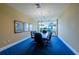 Well-lit conference room with large windows offering scenic views of palm trees and greenery at 130 Riviera Dunes Way # 606, Palmetto, FL 34221