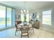 Cozy dining area with tile floors, stylish furniture, and ample natural light at 130 Riviera Dunes Way # 606, Palmetto, FL 34221
