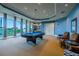 Spacious game room features a pool table, comfortable seating, and large windows with scenic views at 130 Riviera Dunes Way # 606, Palmetto, FL 34221