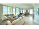 Bright living room featuring elegant furnishings, large windows, and scenic views at 130 Riviera Dunes Way # 606, Palmetto, FL 34221