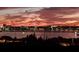 Night view showcasing city lights across the water, creating a vibrant and scenic ambiance at 130 Riviera Dunes Way # 606, Palmetto, FL 34221