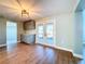 Stylish dining area with updated cabinets, countertops, and access to a serene outdoor area at 13304 Neptune Dr, Hudson, FL 34667