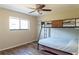 Cozy bedroom featuring a bunk bed, natural light, and sleek flooring at 13305 Whitby Rd, Hudson, FL 34667