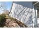 View of the side of the home with garden bed at 13305 Whitby Rd, Hudson, FL 34667