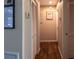 Hallway with modern flooring, neutral paint and closet at 13305 Whitby Rd, Hudson, FL 34667