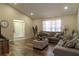 Inviting living room with a large window, comfortable seating, and stylish decor, creating a cozy atmosphere at 13305 Whitby Rd, Hudson, FL 34667