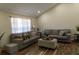 Inviting living room with neutral tones, modern furniture, and wood-look tile flooring at 13305 Whitby Rd, Hudson, FL 34667