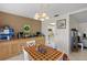 Charming dining room adjacent to the kitchen with tiled floors and built in cabinets at 1348 Aqui Esta Dr, Punta Gorda, FL 33950