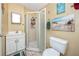 This bathroom features a standing shower and beachy decor at 1579 Magnolia Dr, Clearwater, FL 33756