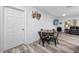 Dining area featuring a round table, new floors, and modern decor, great for gatherings at 1579 Magnolia Dr, Clearwater, FL 33756