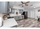 The bright kitchen features gray cabinets, stainless appliances and wood-look flooring at 1579 Magnolia Dr, Clearwater, FL 33756