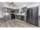 Modern kitchen with gray cabinets, stainless steel appliances, and quartz countertops at 1579 Magnolia Dr, Clearwater, FL 33756