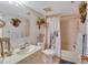 Bathroom with a shower-tub combo, sink and neutral wall color at 1600 Gulf Blvd # 512, Clearwater, FL 33767