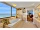 Bright bathroom featuring a large window with ocean views and a soaking tub at 1600 Gulf Blvd # 512, Clearwater, FL 33767