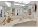 Bright bathroom with a large mirror, vanity, and decorative accents at 1600 Gulf Blvd # 512, Clearwater, FL 33767