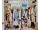 Walk-in closet featuring ample storage space with shelving and hanging racks at 1600 Gulf Blvd # 512, Clearwater, FL 33767