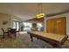 Well-appointed game room with a pool table, chairs, and beach view at 1600 Gulf Blvd # 512, Clearwater, FL 33767