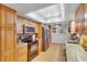 Charming kitchen featuring wood cabinets, granite counters, tile flooring, and stainless steel appliances at 1600 Gulf Blvd # 512, Clearwater, FL 33767