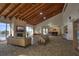 Spacious lounge area with exposed beam ceiling, fireplace, and ocean view at 1600 Gulf Blvd # 512, Clearwater, FL 33767