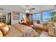 Inviting main bedroom featuring ocean views, a chaise lounge, and an en-suite bathroom at 1600 Gulf Blvd # 512, Clearwater, FL 33767