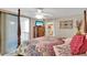 Bedroom features a four-poster bed and private balcony at 1600 Gulf Blvd # 512, Clearwater, FL 33767