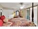 Bedroom features a four-poster bed and balcony access at 1600 Gulf Blvd # 512, Clearwater, FL 33767