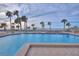 Inviting outdoor swimming pool with beach views and lounge chairs at 1600 Gulf Blvd # 512, Clearwater, FL 33767
