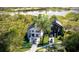 Aerial view of luxury homes surrounded by lush greenery, offering serene waterfront living at 1870 Stevenson Ave, Clearwater, FL 33755