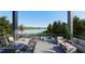 Stunning outdoor space with lake view, dining area and comfy seating for relaxing and entertaining at 1870 Stevenson Ave, Clearwater, FL 33755