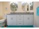 Bathroom featuring a double sink, granite countertops and white cabinetry at 2016 E View Dr, Sun City Center, FL 33573