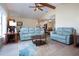 Spacious living room with vaulted ceilings, open floor plan, and lake views at 2016 E View Dr, Sun City Center, FL 33573